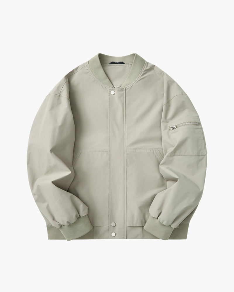 Sage-green bomber jacket with ribbed collar, snap placket and sleeve zip pocket, flat-lay front view
