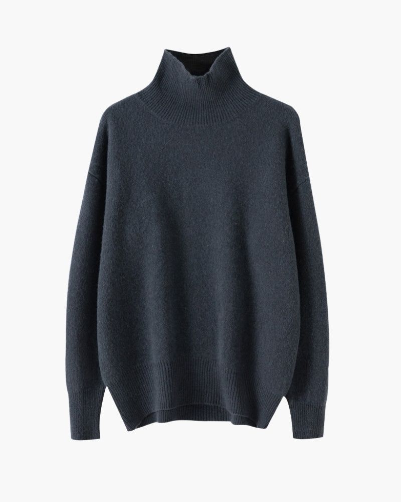 Navy lightweight knit turtleneck with ribbed cuffs and side-slit hem, flat front view