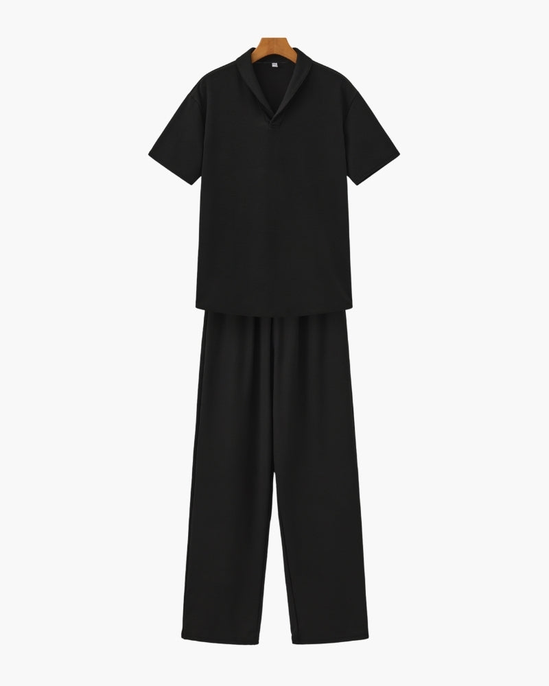 Black short-sleeve polo and wide-leg drawstring trousers set, flat front view on a hanger