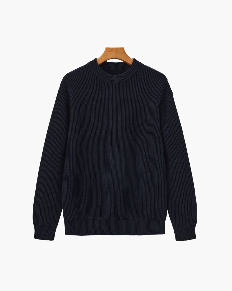 Navy chunky rib-knit crew-neck jumper with ribbed cuffs and hem, front view on a wooden hanger