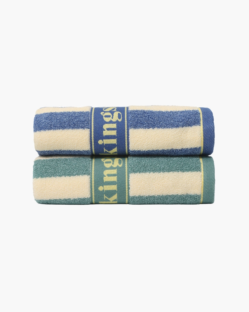 Two folded striped terry hand towels, blue and green, with woven band across the middle