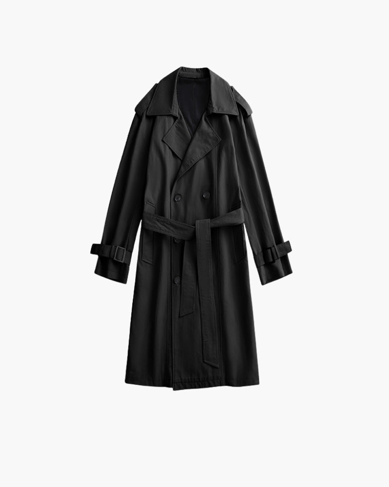 Black double-breasted trench coat with belt and buckled cuff straps on a hanger, front view