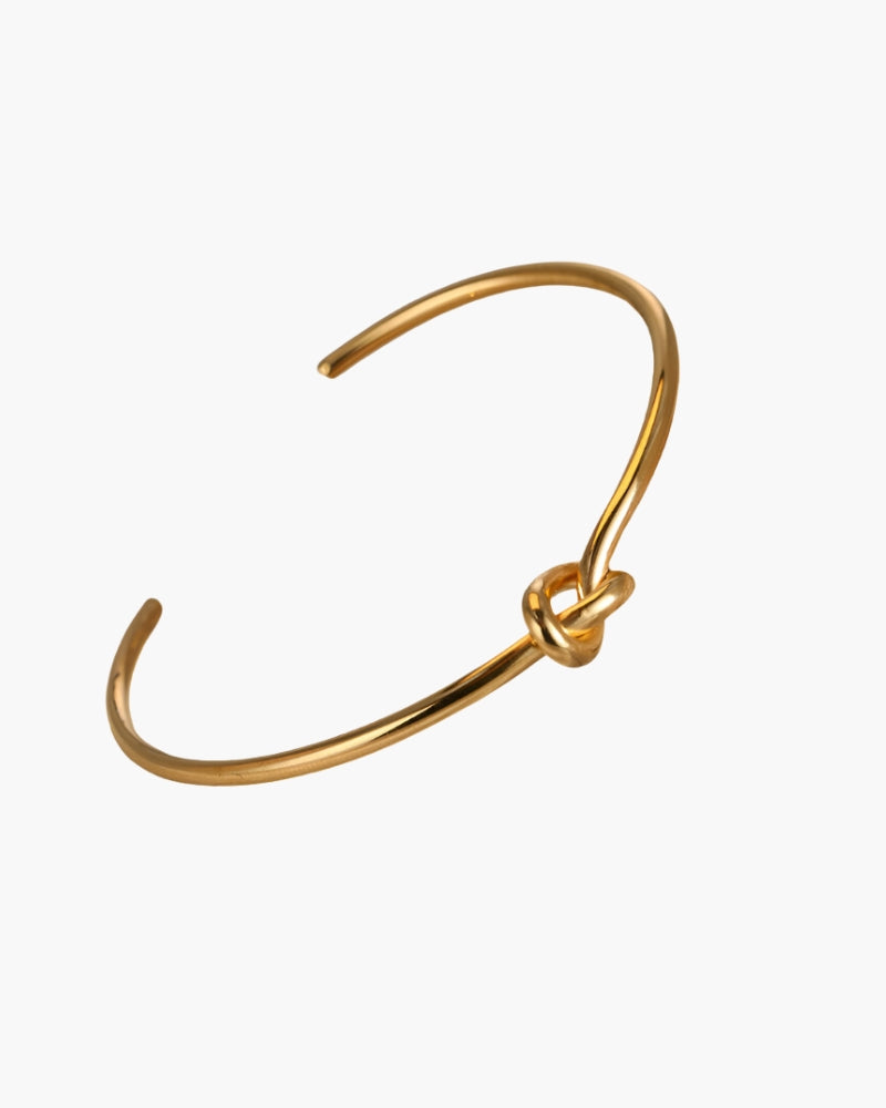 Brazalete abierto de nudo dorado, en plano sobre blanco – Brazalete de nudo de acero inoxidable para mujer