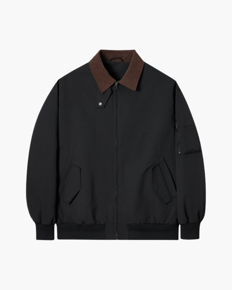Black harrington jacket with brown corduroy collar, zip front and sleeve pocket, flat front view