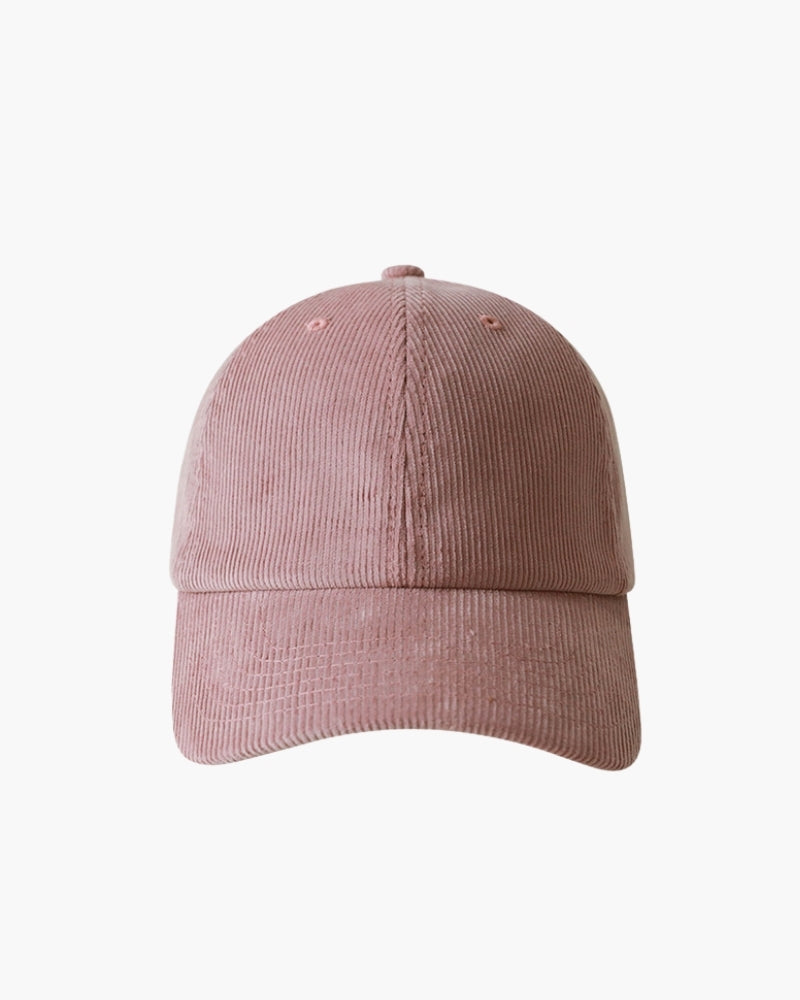Rose pink corduroy cap with curved brim, front view on white