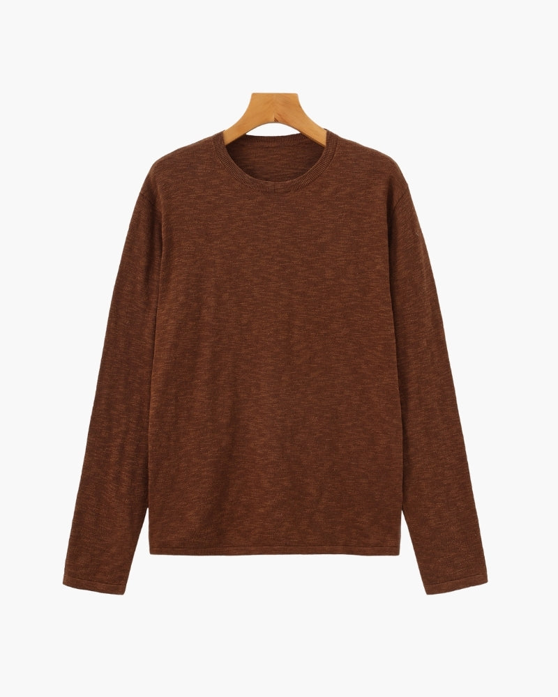 Rust brown linen-cotton long-sleeve crewneck tee, front flat-lay on hanger
