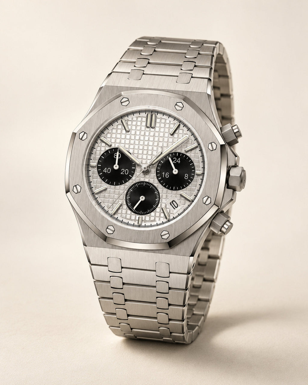 Silver octagonal-bezel chronograph watch with silver dial and black subdials, angled studio shot