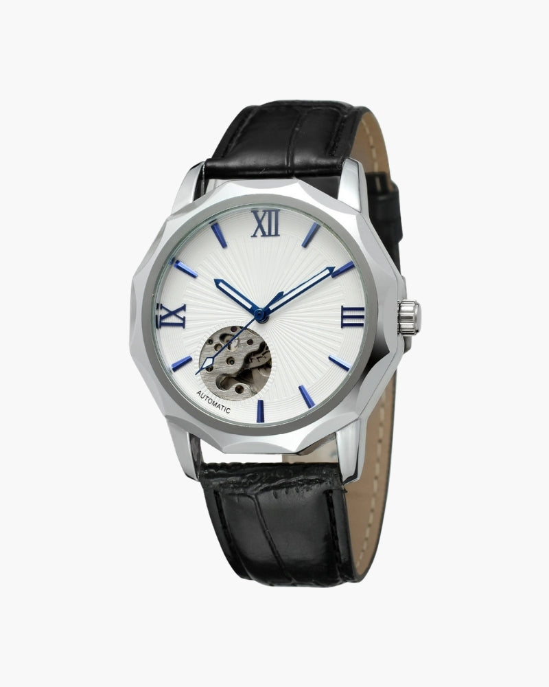 Steel faceted-case watch with white skeleton dial, blue Roman numerals and black leather strap, front view