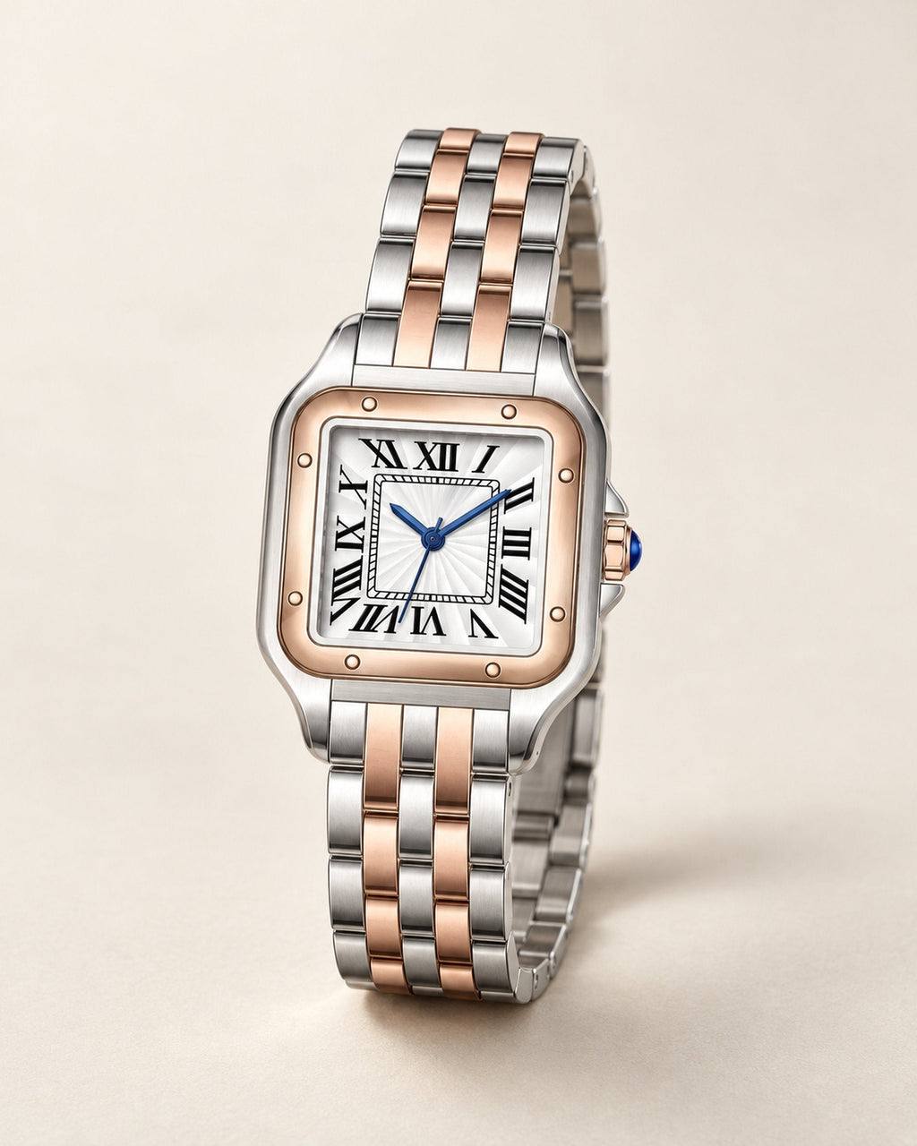 Two-tone steel and rose-gold square watch with Roman-numeral dial and blue hands, angled view