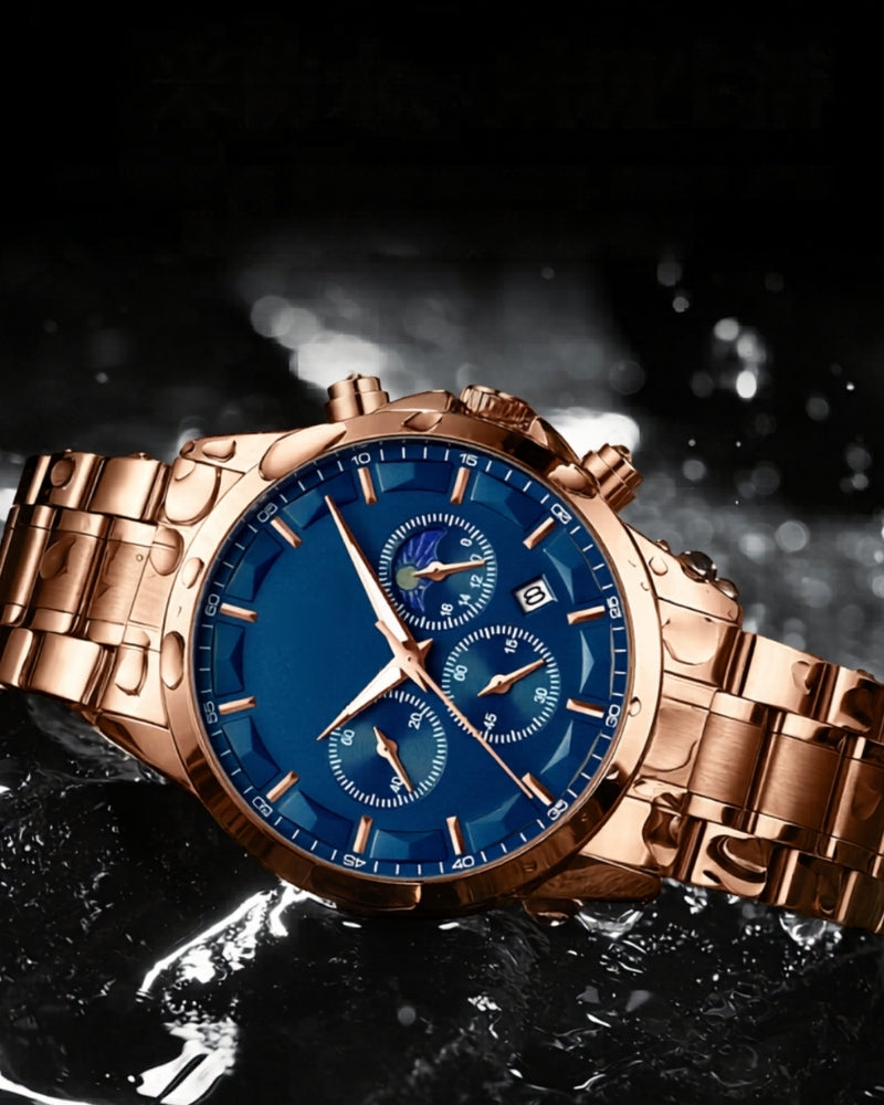 Rose-gold chronograph watch with blue dial lying on a wet black surface with water droplets