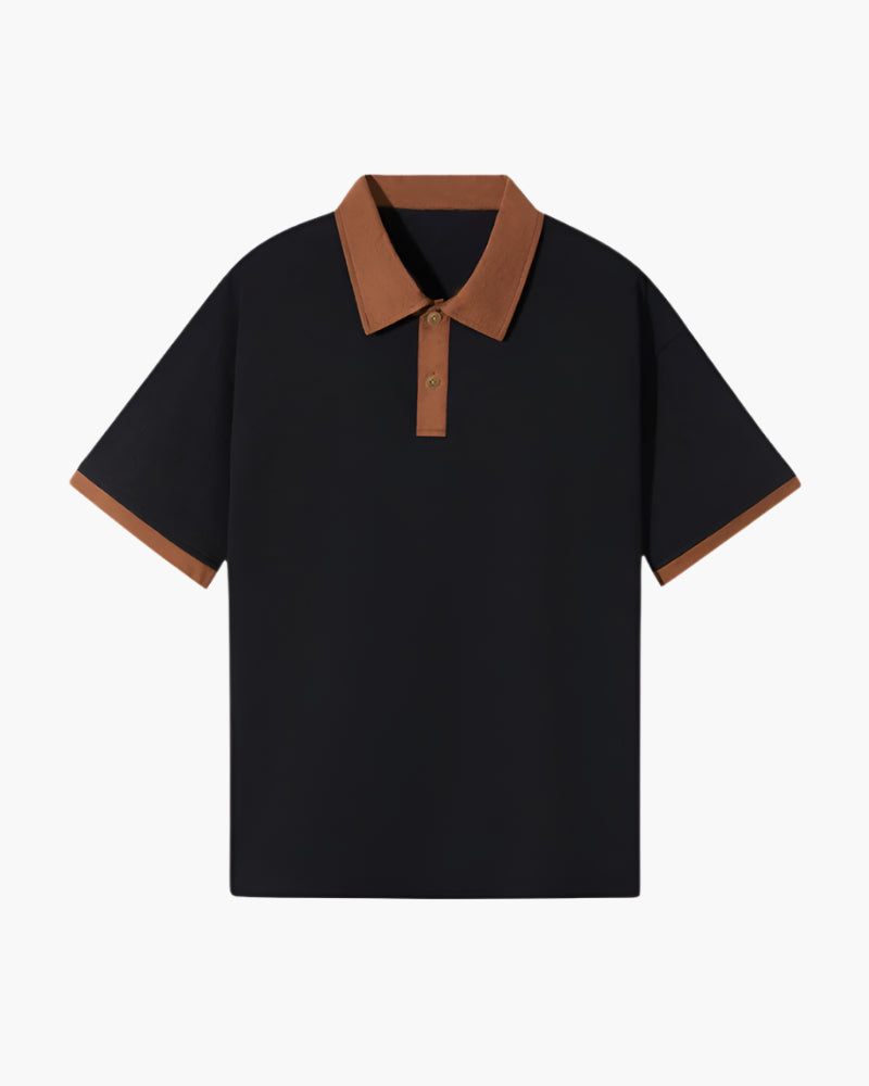 Black polo shirt with brown contrast collar, placket and sleeve trim, flat-lay front view