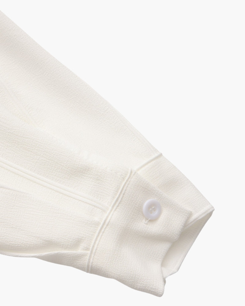 Close-up of white ribbed shirt cuff with white button, St Tropez men's shirt