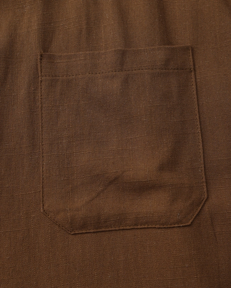 Close-up of brown textured shirt chest pocket – Men's Mandarin Collar Shirt