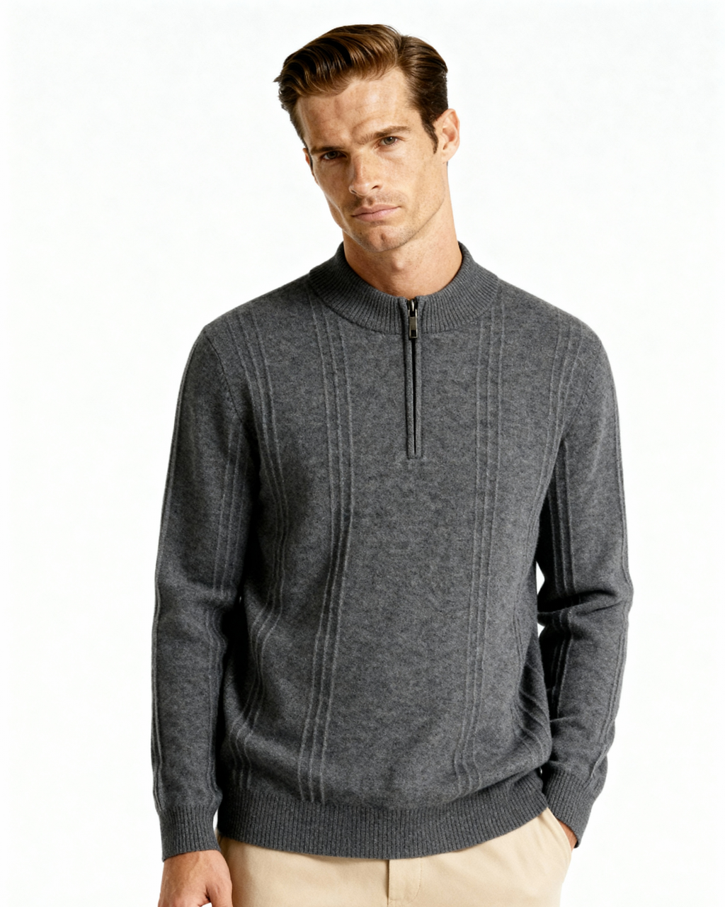 Man in a grey cashmere half-zip jumper with ribbed panels and beige trousers, front view