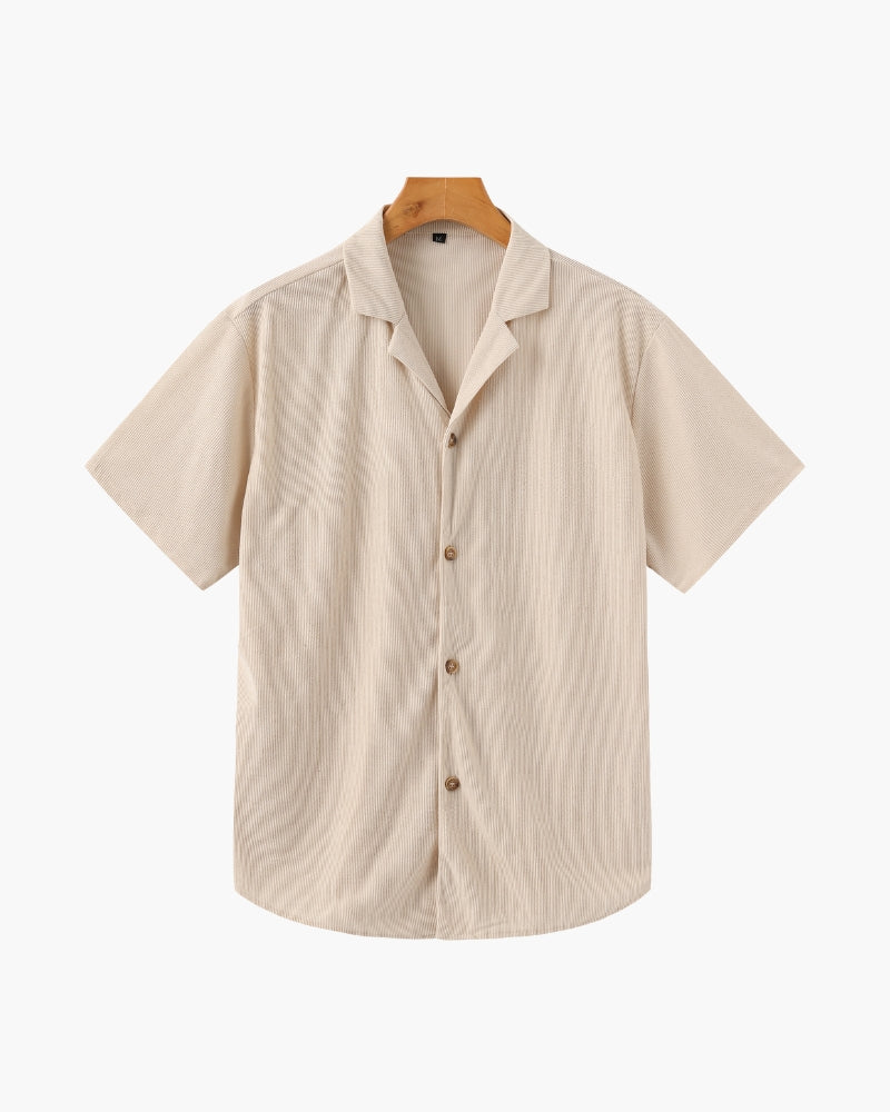 Beige ribbed camp-collar short-sleeve shirt with horn-effect buttons on a hanger, front view
