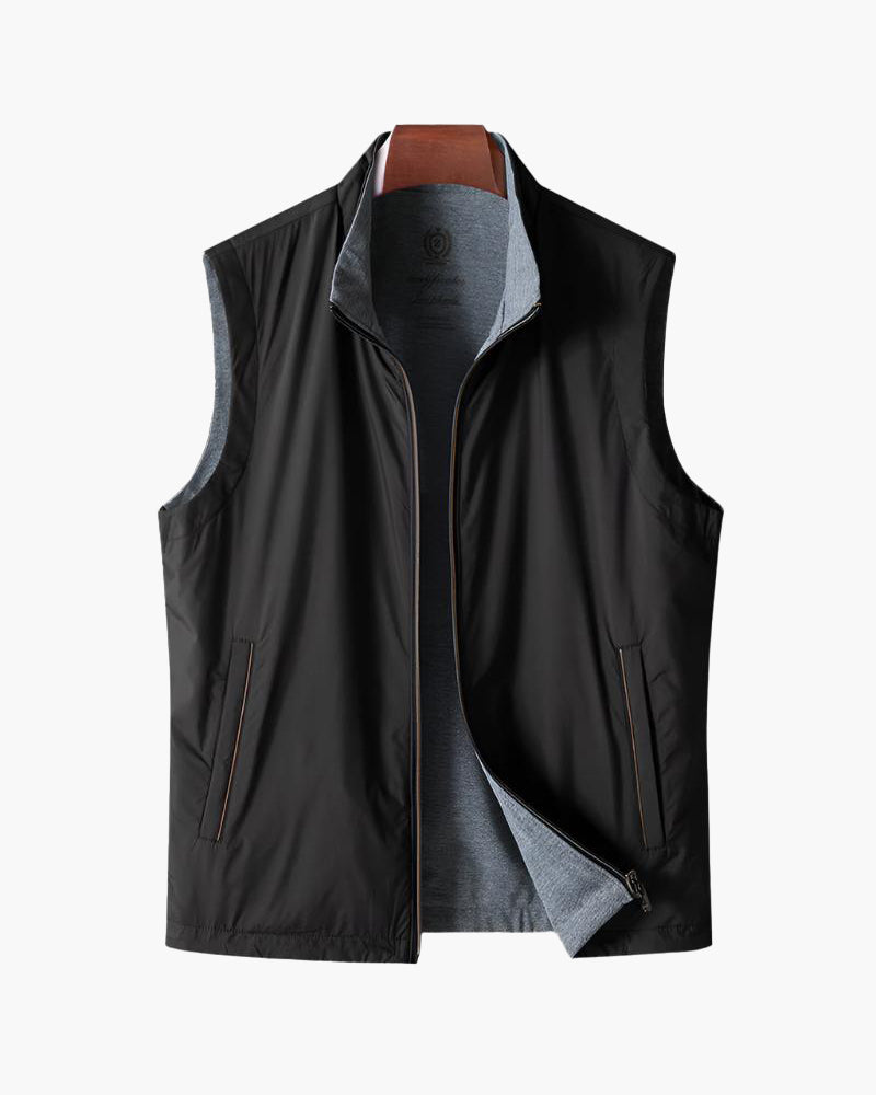 Black zip-up bodywarmer with grey jersey lining and side pockets, flat front view