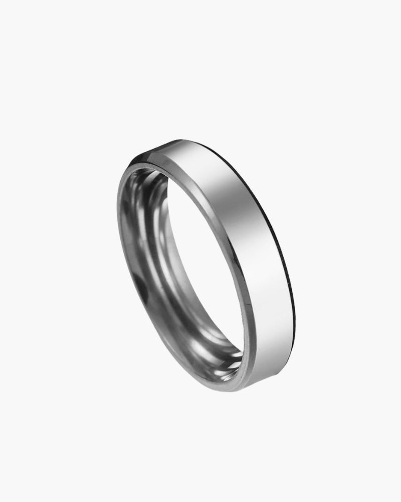 Silver-tone steel band ring with bevelled edges, angled view