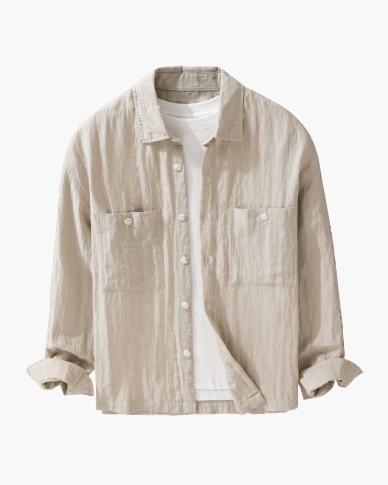 Beige crinkled linen overshirt with two chest pockets, open over a white tee, flat-lay front view