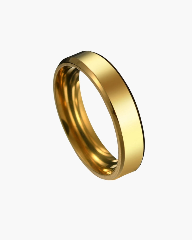 Gold-tone steel band ring with bevelled edges, angled view, Trinity steel ring