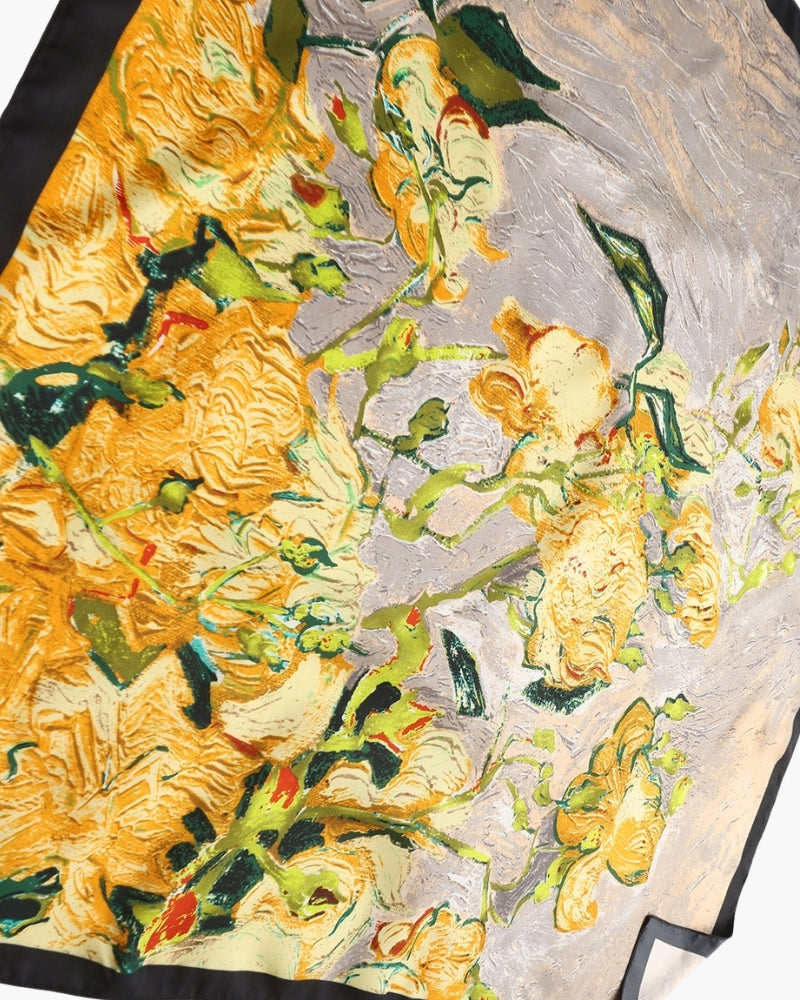 Close-up of yellow rose painterly print on grey silk-feel scarf