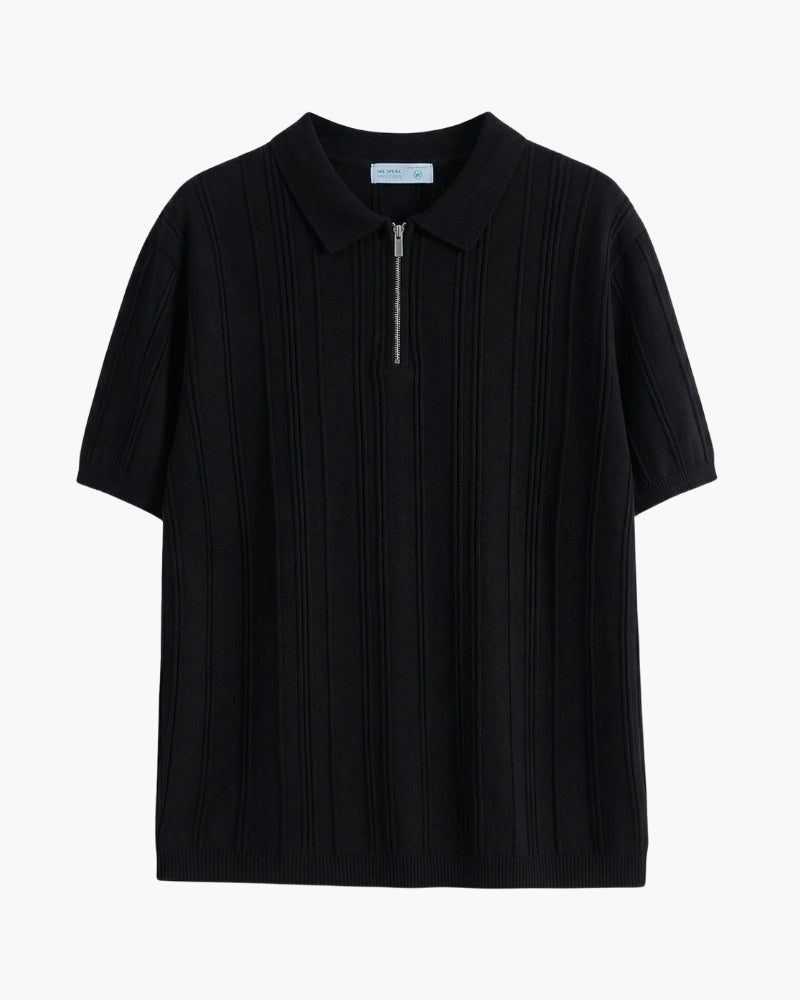 Black vertical-ribbed knit polo with metal quarter zip, flat-lay front view