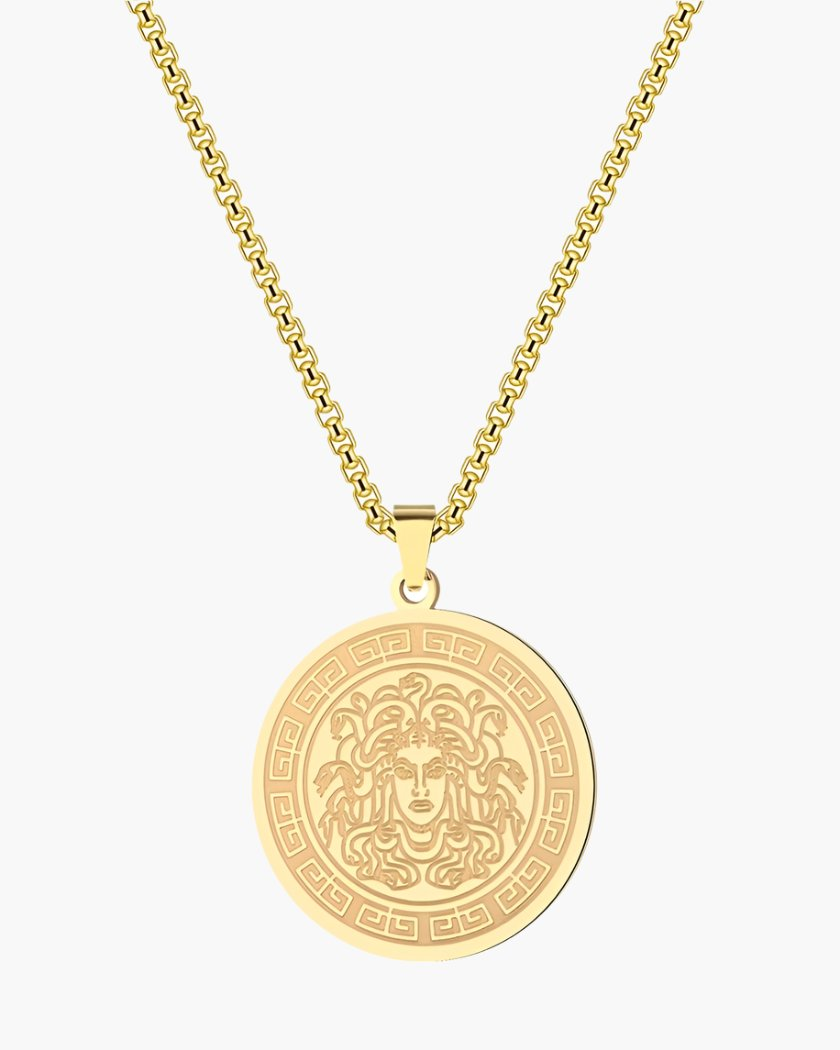 Gold-tone round pendant with engraved Medusa head and Greek key border on a link chain
