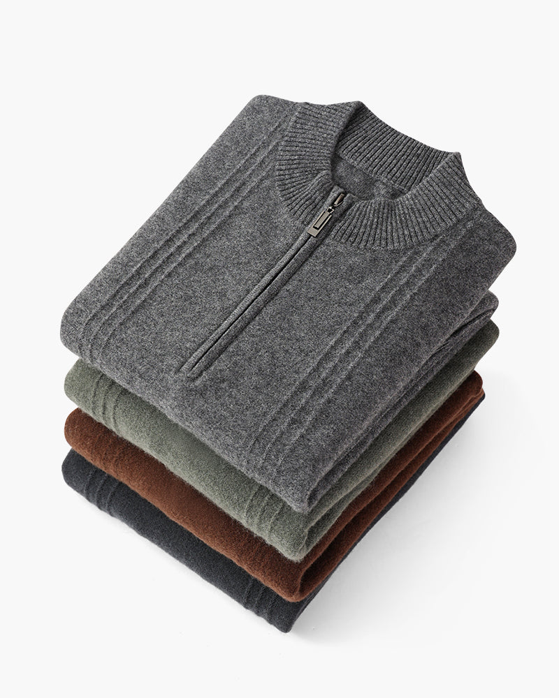 Folded stack of cashmere half-zip jumpers in grey, olive, brown and charcoal