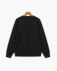 Black modal-cotton crewneck sweatshirt with ribbed cuffs and hem on a hanger, front view