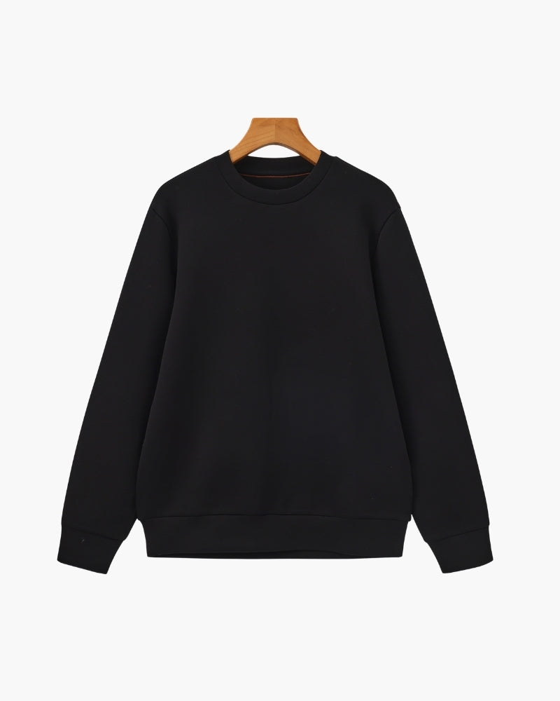 Black modal-cotton crewneck sweatshirt with ribbed cuffs and hem on a hanger, front view