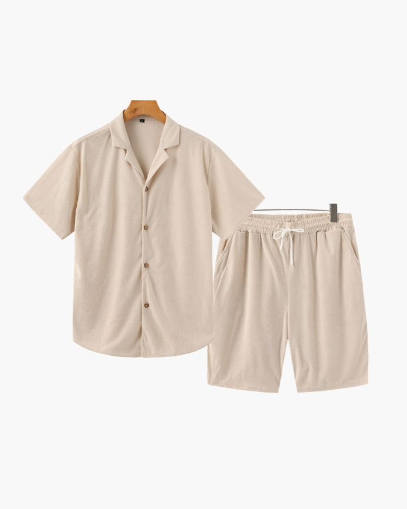 Beige ribbed camp-collar shirt and drawstring shorts set, flat-lay on hangers