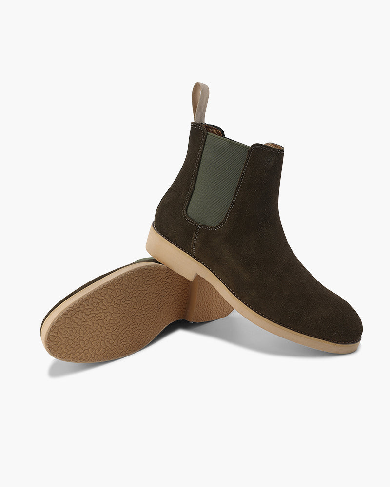 Dark olive suede Chelsea boot with the crepe sole turned beside it