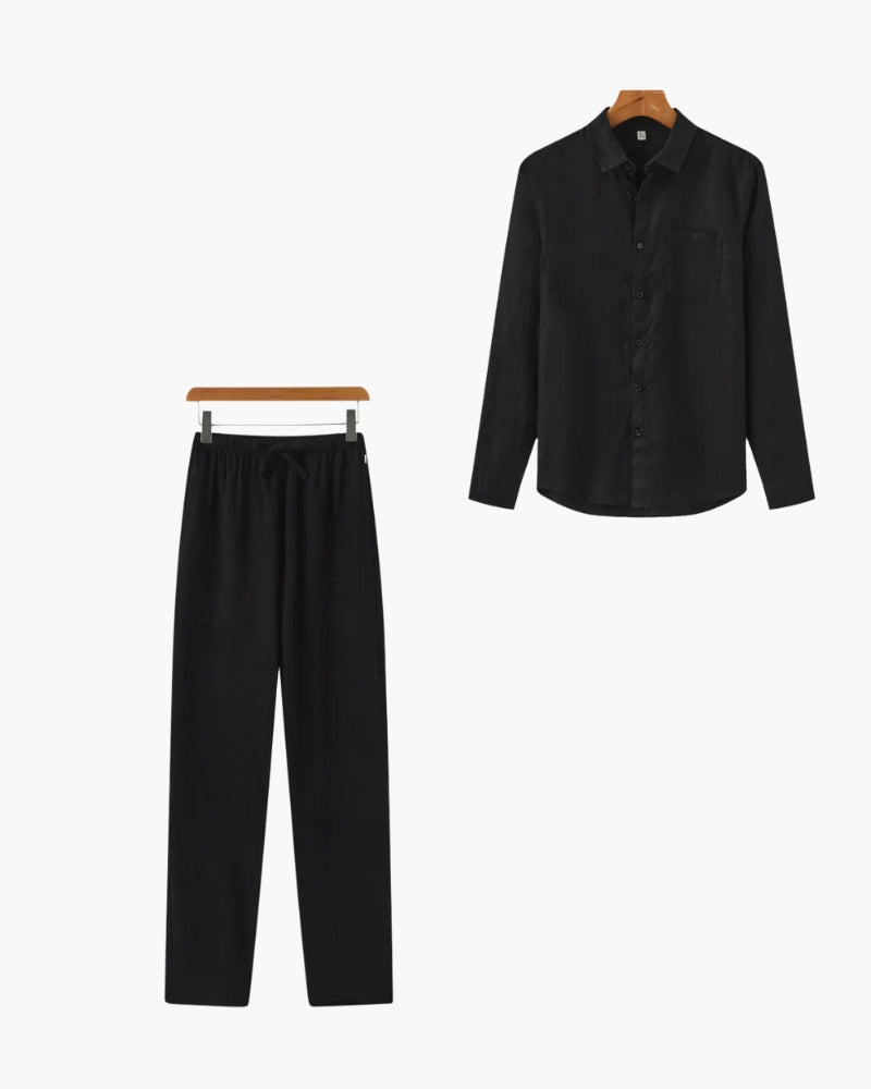Black linen shirt and drawstring trousers set, flat-lay on hangers