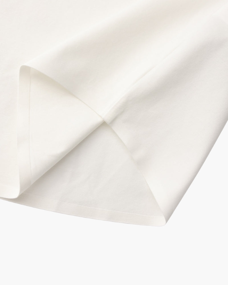Close-up of white shirt hem and side seam, men's stretch cotton shirt