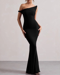 Woman in black off-the-shoulder bodycon maxi dress with twisted strap and flared hem, front view