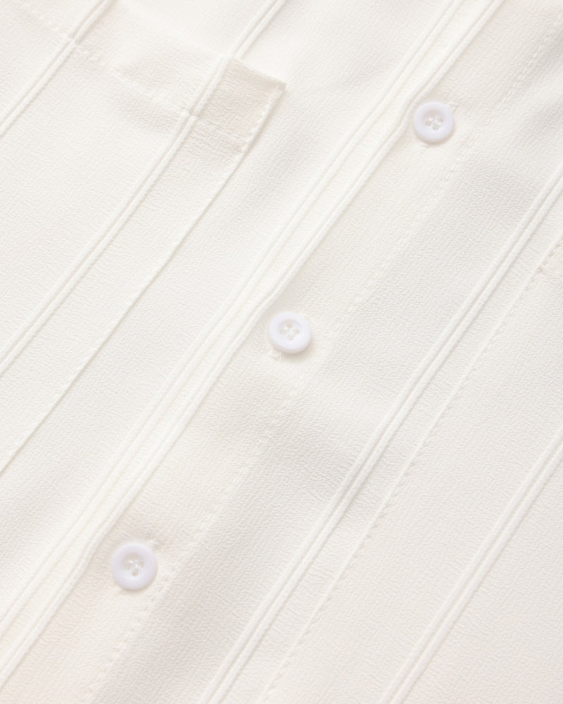Close-up of white ribbed shirt placket with white buttons, St Tropez men's shirt