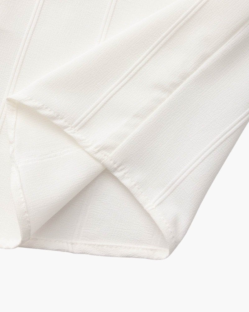 Close-up of white ribbed shirt hem stitching, St Tropez men's shirt