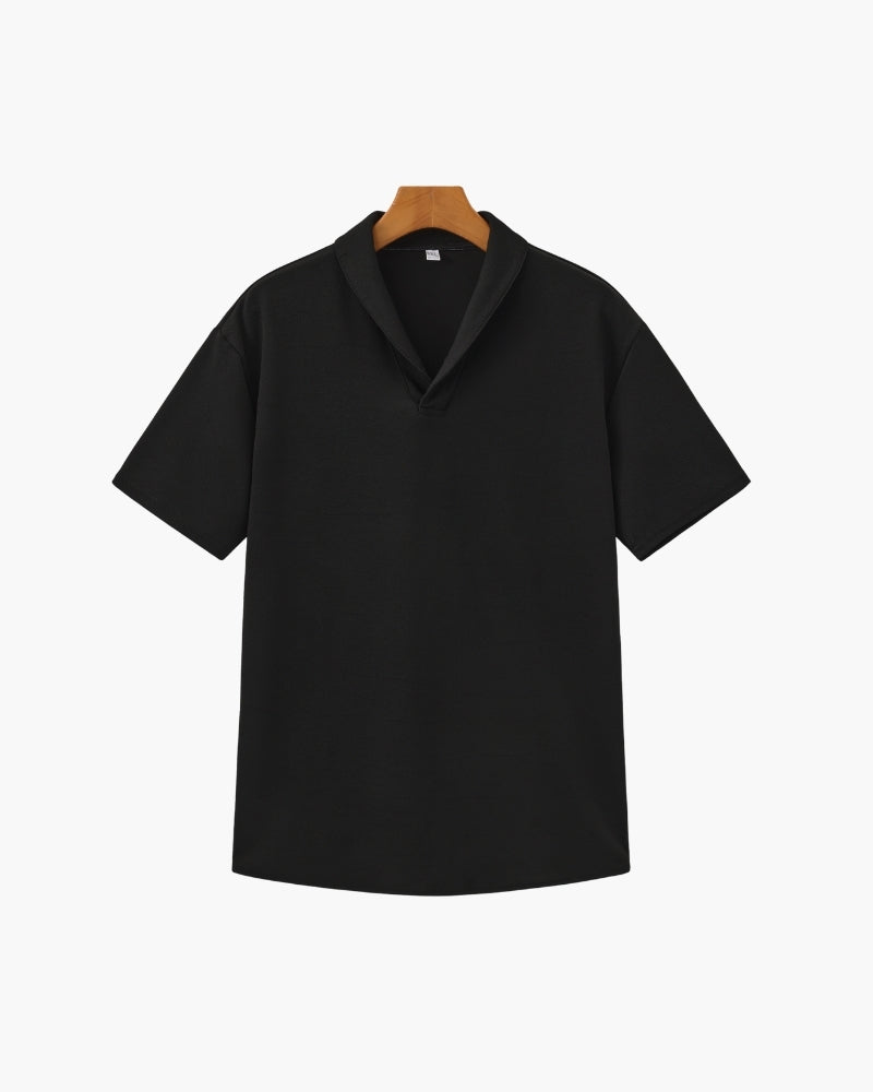 Black short-sleeve notch-collar polo with textured fabric on a hanger, front view