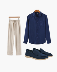 Lookbook flat-lay: navy linen shirt, beige drawstring trousers and navy suede loafers with beige soles