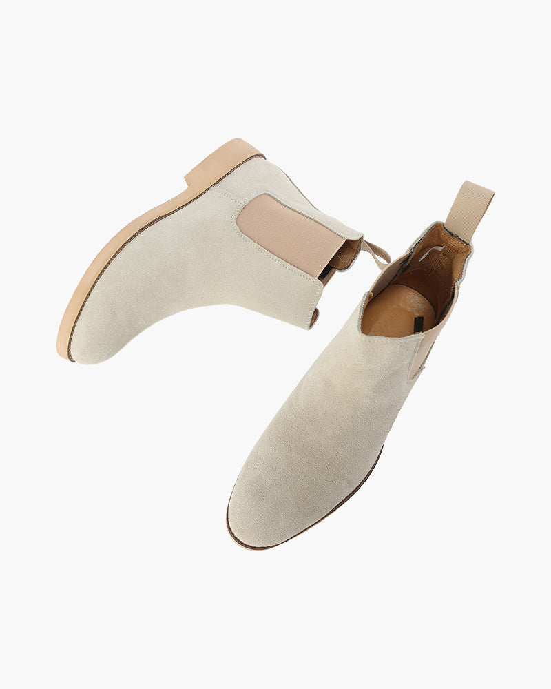 Pair of stone grey suede Chelsea boots seen from above showing pull tabs