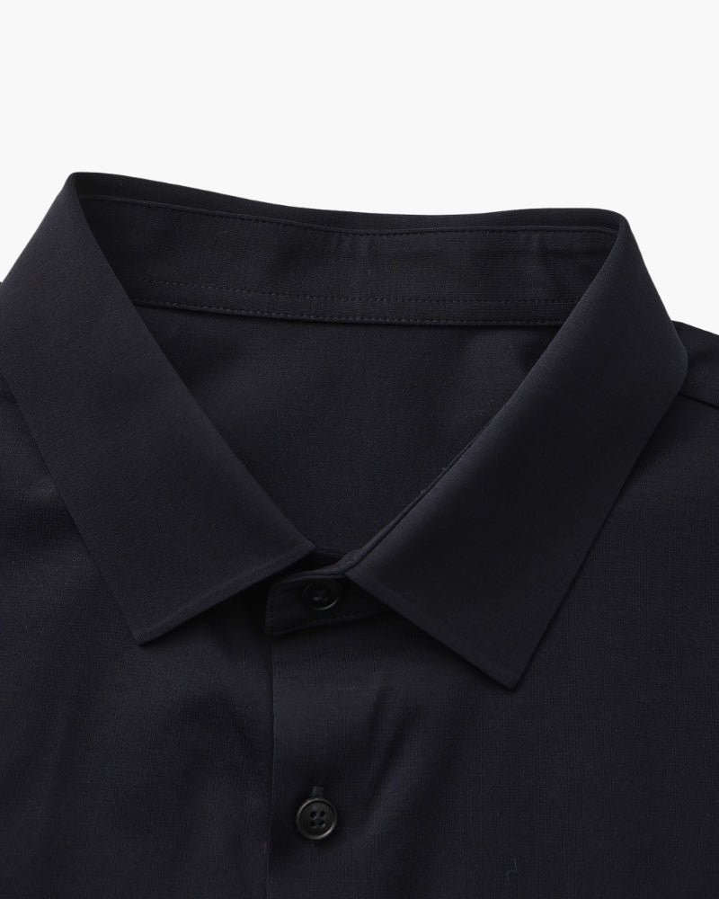 Close-up of navy shirt collar and dark buttons, men's stretch cotton shirt