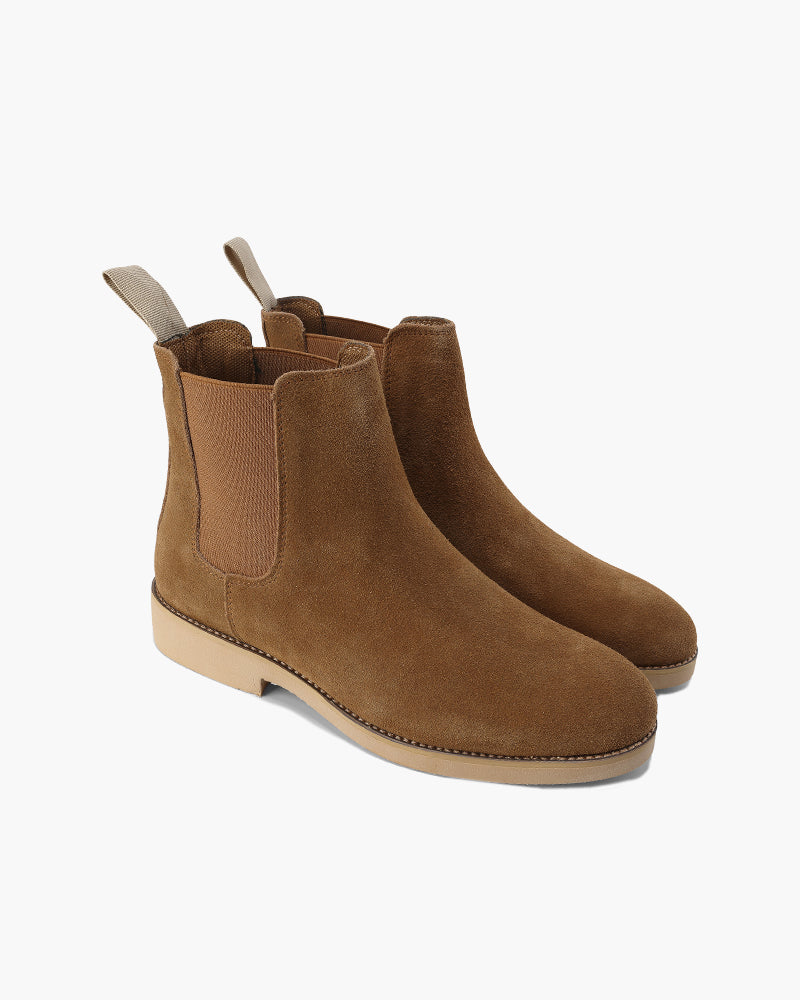 Pair of tan suede Chelsea boots with elastic side panels and crepe sole
