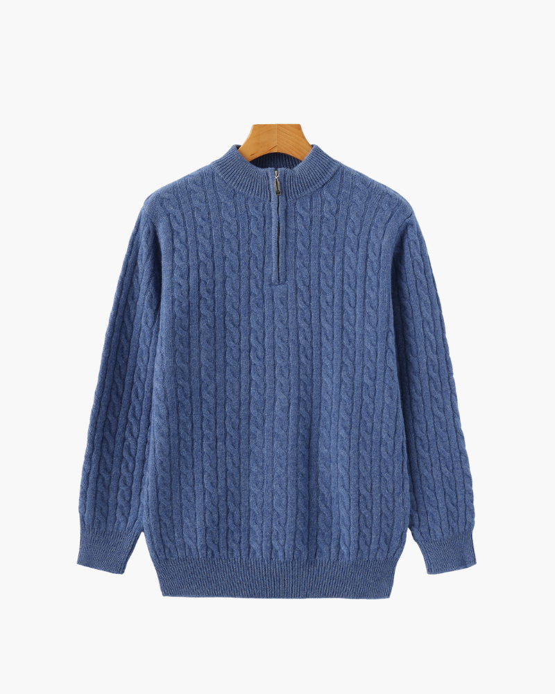 Blue cable-knit quarter-zip jumper with ribbed cuffs on a wooden hanger, flat front view