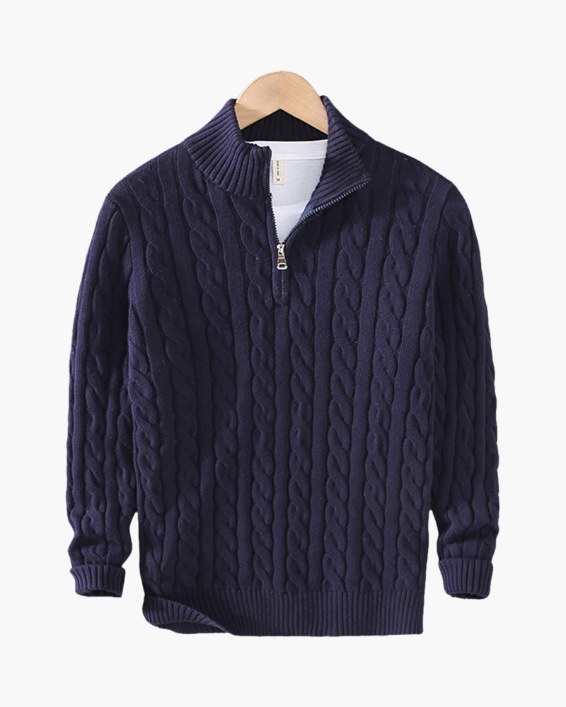 Navy cable-knit half-zip jumper on a wooden hanger, flat front view