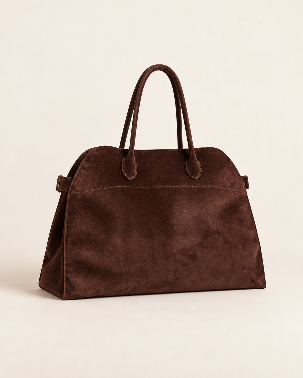 Dark brown suede-look arched handbag with two rolled handles, angled three-quarter view